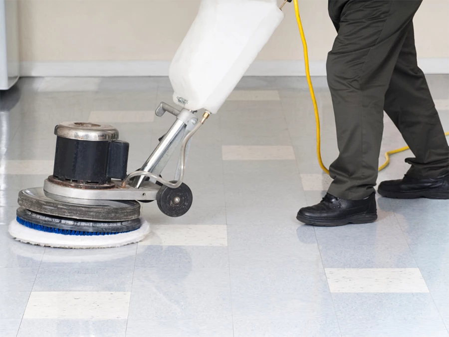 Worker using a floor buffer to polish a concrete floor, showcasing services at Concrete Floor Polishing Near Fonmeadow Patio Homes