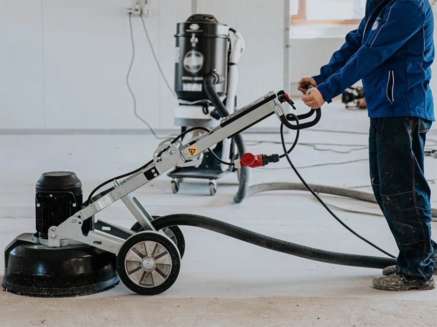 Concrete grinding machine in action, highlighting Concrete Polishing in Fonmeadow Patio Homes.