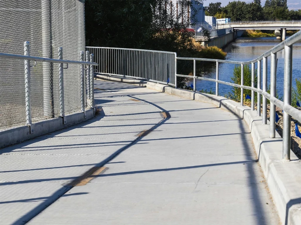 Outdoor concrete floor finishing in Quail Village along a scenic walkway