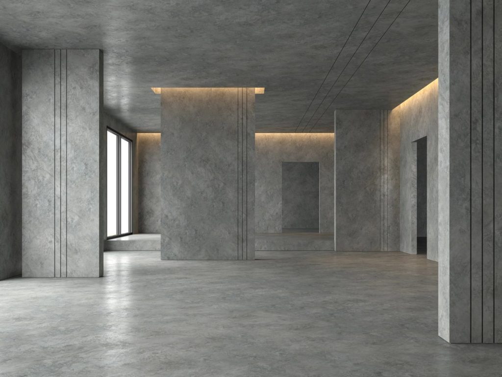 Modern room with polished concrete floor by a Houston concrete polishing company, featuring sleek design and lighting.