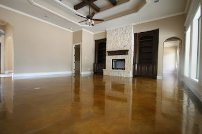Stunning polished cement floor in a Houston home by expert cement polishing contractors, featuring a glossy finish.