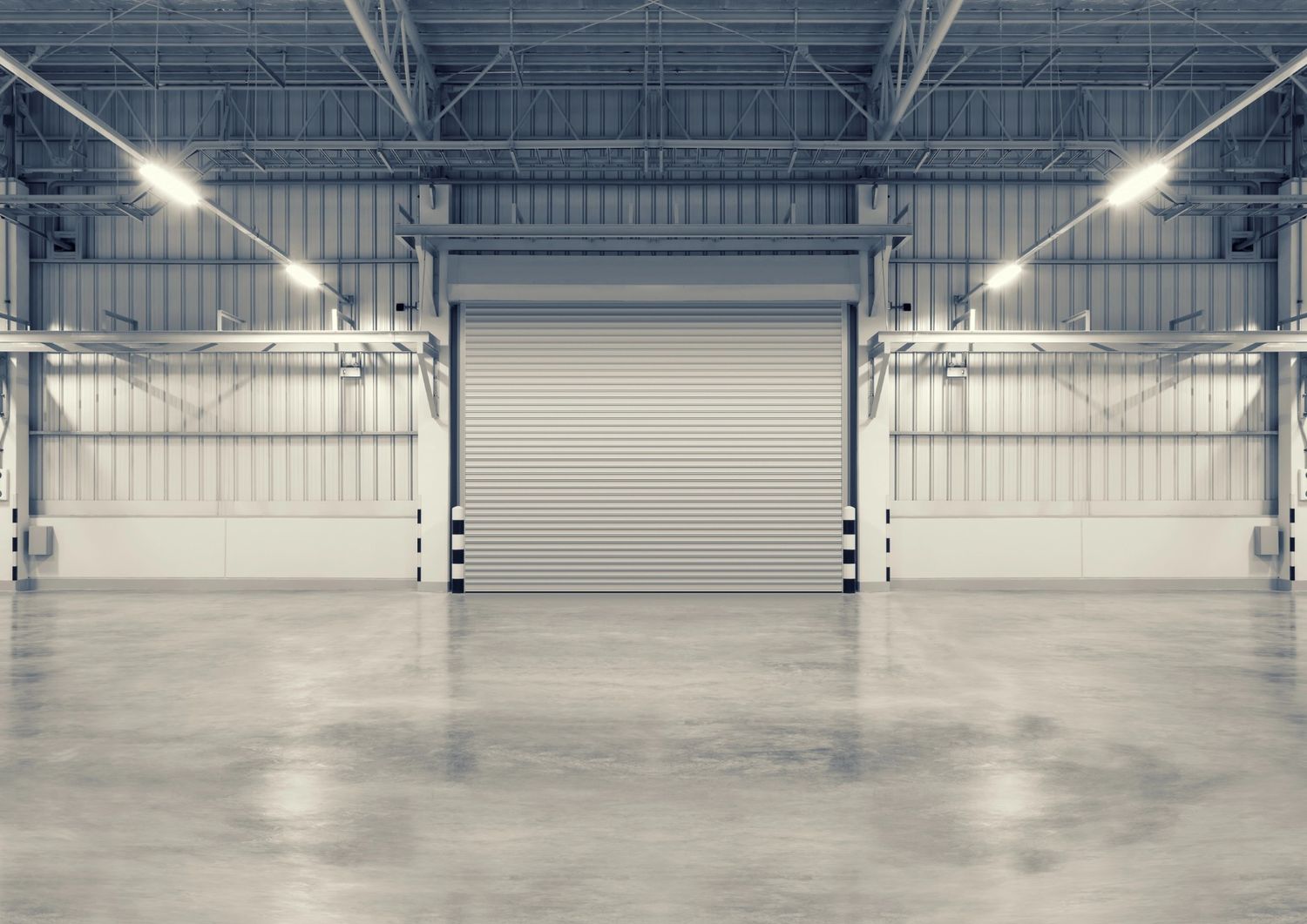 Polished concrete services in Houston smoothing a floor with a grinder in a modern retail space.