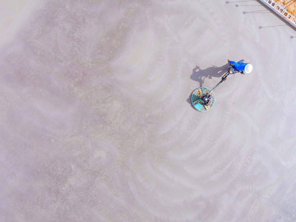 Glossy polished cement floor by skilled contractors in a Houston commercial space.