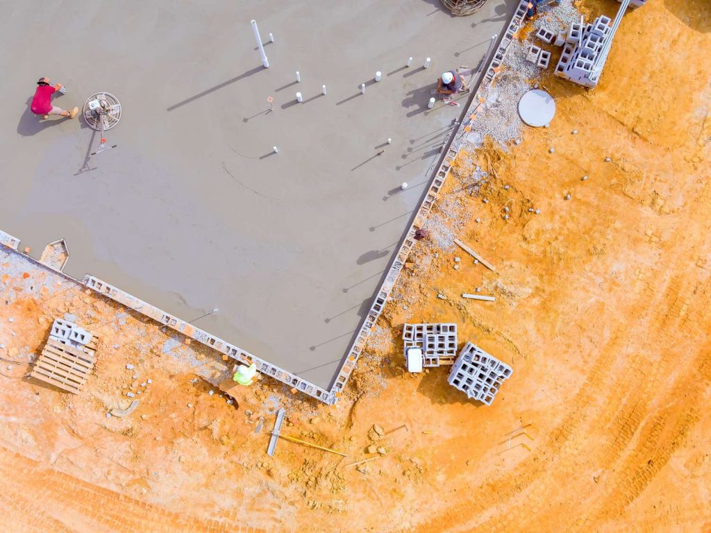 Modern Houston office with glossy polished cement floors by expert contractors.