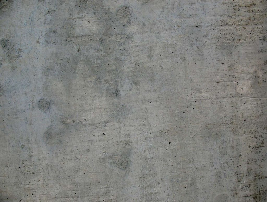 Industrial-style, light gray rough surface texture of natural finished cement flooring Houston before sealing.