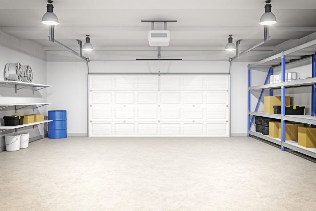 Expert work by cement polishing contractors Houston in a clean, brightly lit garage with ample shelving.