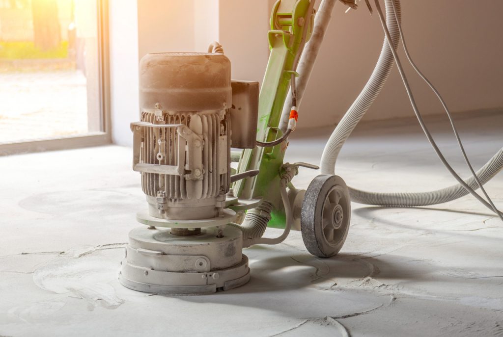 Professional equipment performing polishing concrete services Houston contractors provide for bright and modern interiors.
