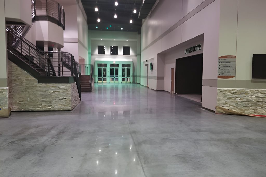 Modern lobby featuring glossy polished concrete flooring completed by an experienced cement polishing company san-antonio
