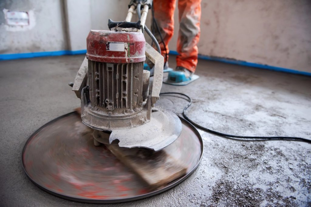 An industrial electric machine provides expert cement polishing flooring Houston for a smooth and durable finish.