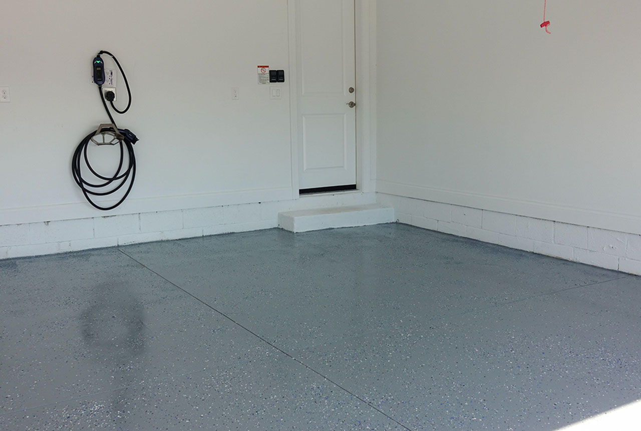 Clean residential garage flooring finished by polished cement services San Antonio, delivering smooth, low-maintenance concrete surfaces