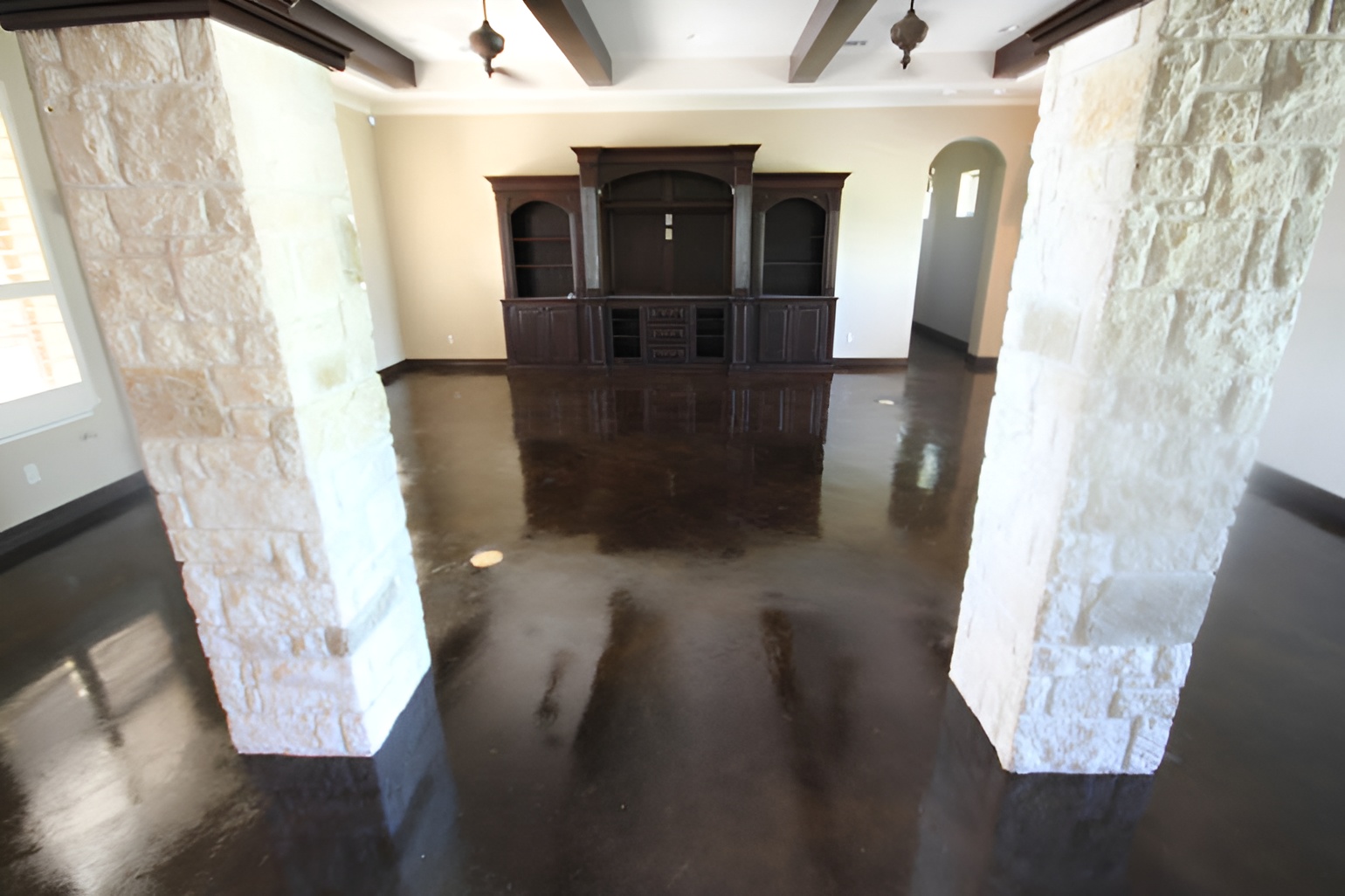 Shiny cement flooring Dallas enhancing a luxury living room with polished concrete floors and elegant reflective finish
