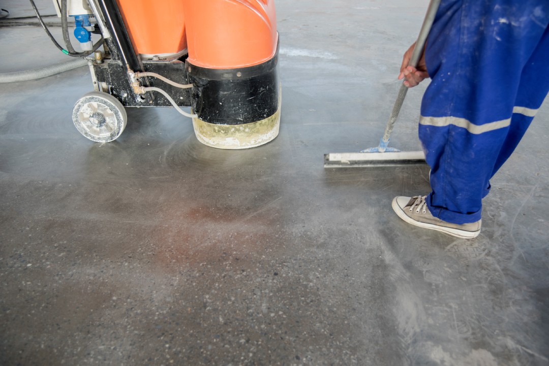 Professional wet grinding process for durable floors from a premier polished concrete company Houston service provider.