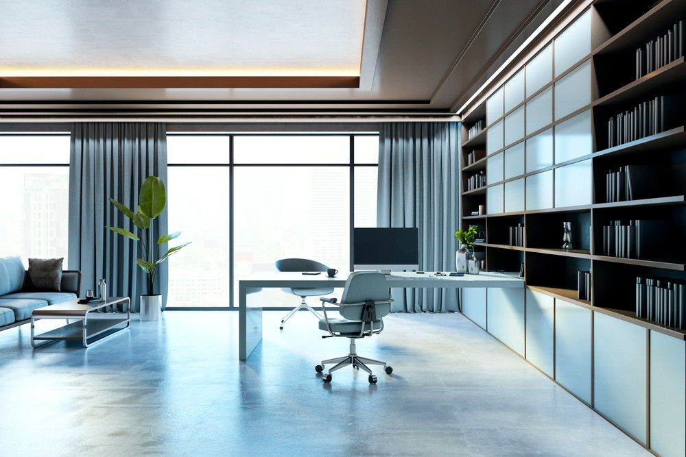 A sophisticated modern home office interior showcasing a smooth and reflective refinished concrete flooring Houston