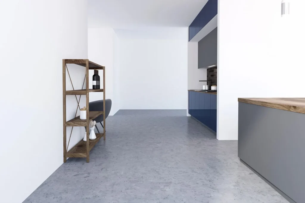 Sleek modern kitchen featuring durable grey floors crafted by a top polished concrete company Houston.