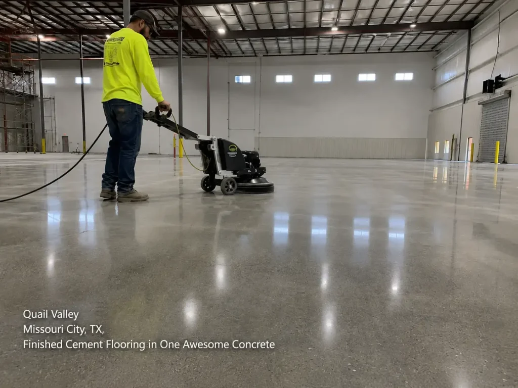 Technician grinding a highly reflective finished cement flooring houston commercial warehouse with equipment.