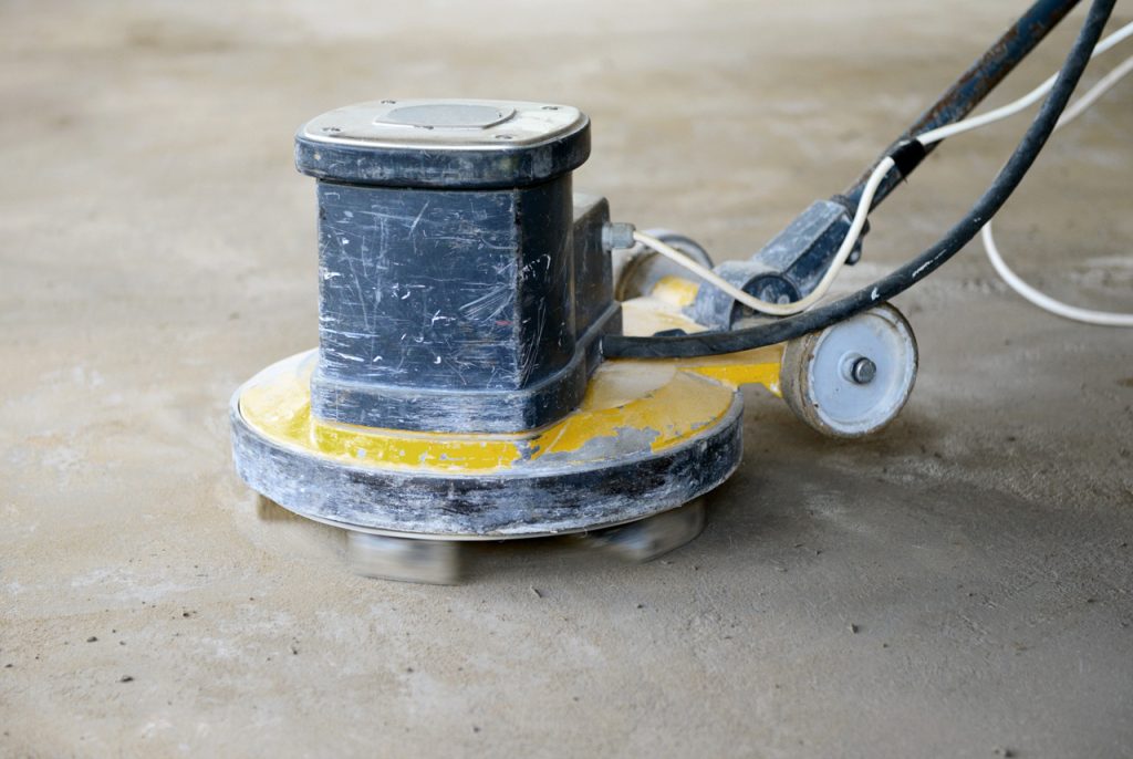 Heavy duty equipment used for cement polishing flooring Houston to achieve a durable and level surface.