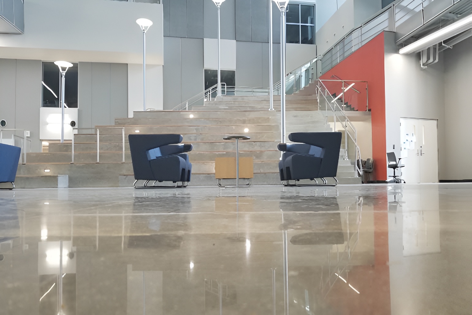 Shiny cement flooring Dallas showcasing a polished commercial hallway with reflective concrete floors designed for durability, elegance, and high foot traffic.